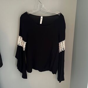 Black long bell sleeve top from Impeccable pig. Medium. 100% rayon.